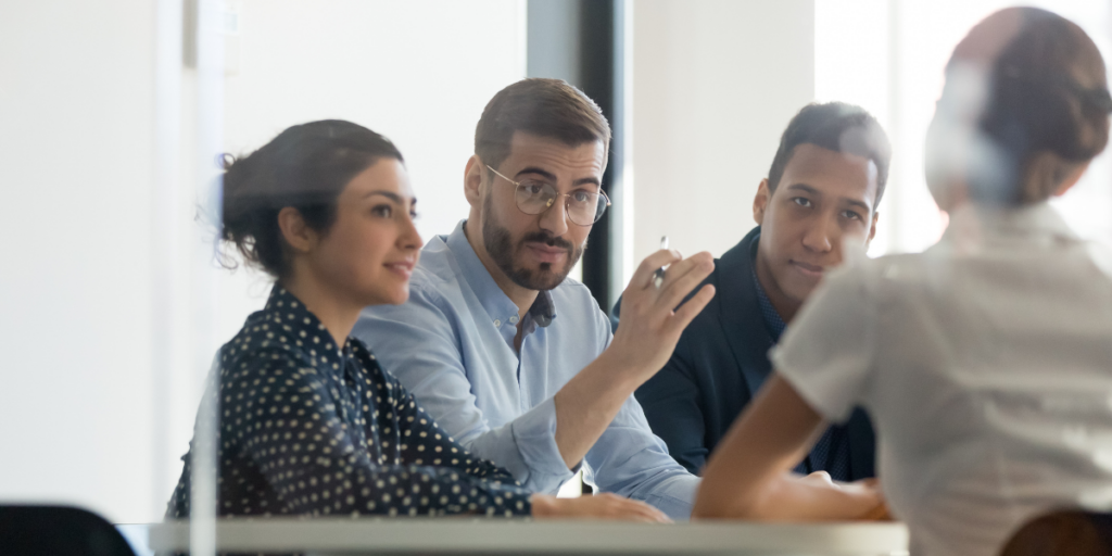 Image of people talking sitting at a table